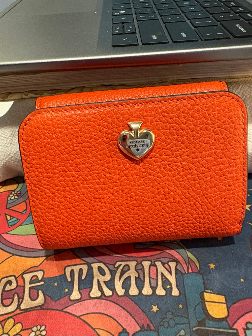 Orange Textured Leather Wallet with Heart Emblem. Kate Spade. New with out tags